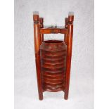 A SET OF CHINESE WOODEN COASTERS in a fitted outer case, 19.5" high