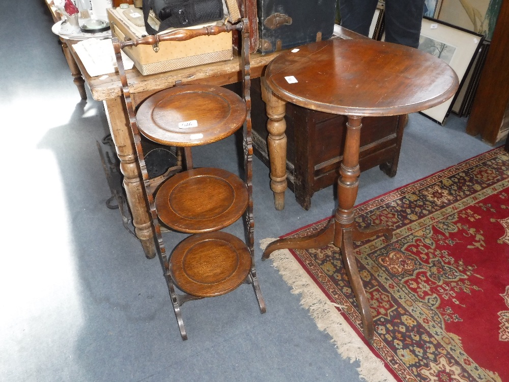 A 19TH CENTURY TRIPOD TABLE and an oak folding cake stand