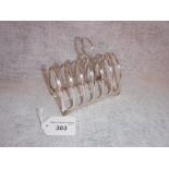 A GEORGE V SILVER SIX DIVISION TOAST RACK, hallmarked Sheffield, 1926