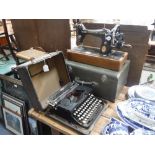 A VINTAGE ROYAL TYPEWRITER and a Singer sewing machine