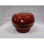A CHINESE RED LACQUER FOOD CONTAINER , brass bound with cover, 9.5" high