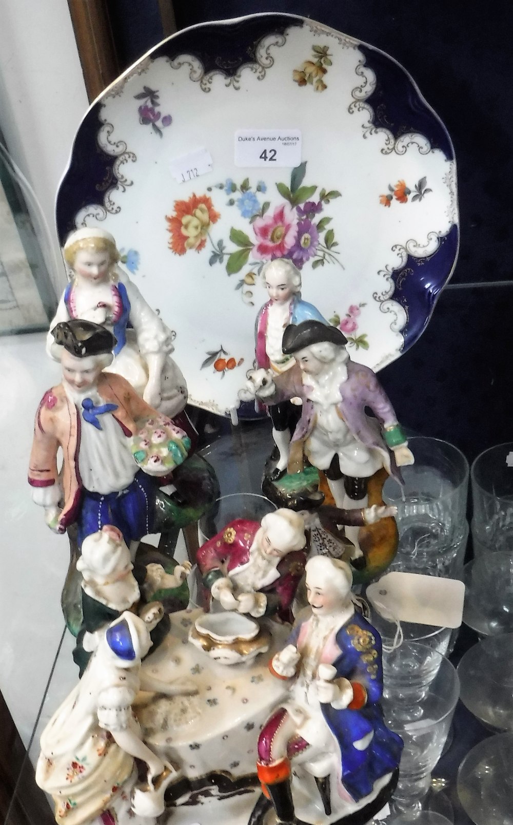 A COLLECTION OF CONTINENTAL PORCELAIN FIGURES and a dessert plate