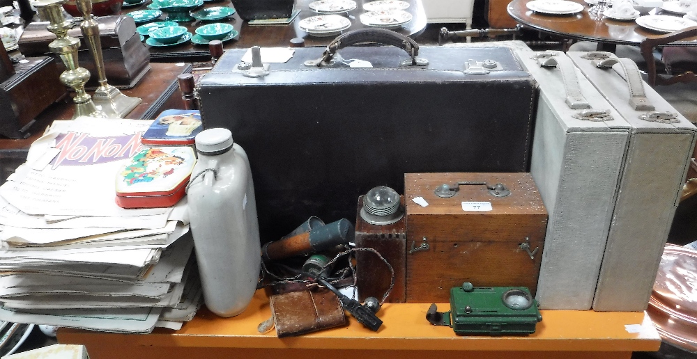 A LEATHER SUITCASE CONTAINING BUTTONS, a collection of sheet music, vintage torches and sundries