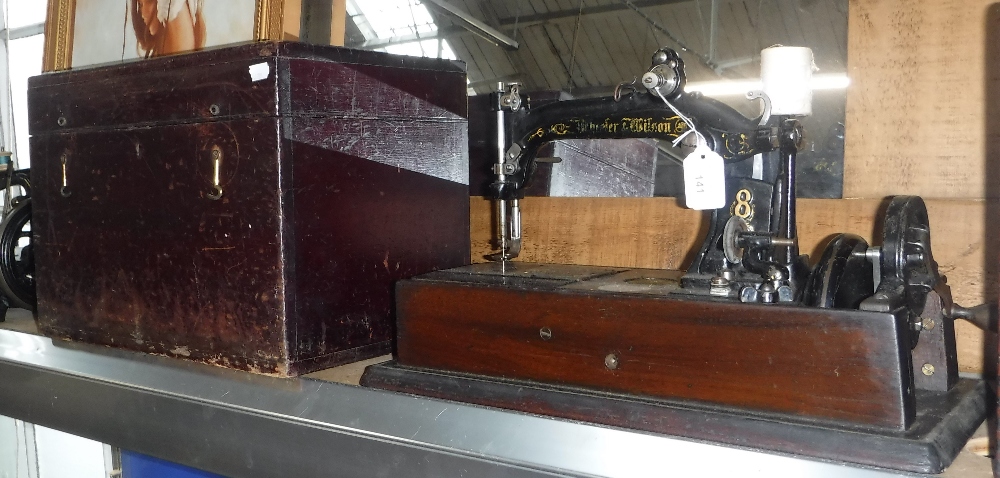 A VINTAGE 'WHEELER & WILSON' SEWING MACHINE with case