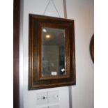 A 19TH CENTURY WALL MIRROR in a gilt and painted rectangular frame, 21" high x 15" wide