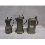 A HEAVY PEWTER TANKARD, engraved on lid 'MZ', one other tankard and a jug (3)