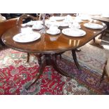 A REPRODUCTION MAHOGANY AND BRASS INLAID PEDESTAL DINING TABLE, 39" wide x 104" long (including