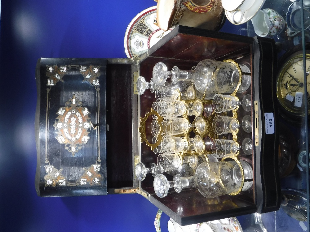 A FRENCH EBONISED WOOD DRINKS CABINET with removable gilt metal mounted tray containing glasses