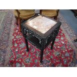 A 19TH CENTURY CHINESE CARVED HARDWOOD TABLE of square form with inlaid rouge marble top, 23.5" high