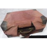 A VICTORIAN LEATHER TRAVELLING CASE with fitted interior containing silver-topped glass bottles,