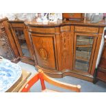 A VICTORIAN SATINWOOD AND MARQUETRY INLAID SERPENTINE CREDENZA, the central bowfronted door inlaid