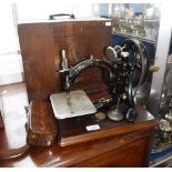 A VICTORIAN WILLCOX & GIBBS SEWING MACHING with original case