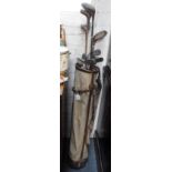 A COLLECTION OF VINTAGE GOLF CLUBS contained in a leather trimmed canvas bag