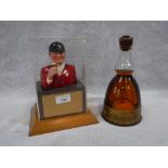 A 1950'S/60'S HUNTSMAN ELDRIDGE POPE FIGURE under a Perspex case on wooden base, 9" high and a