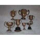 A COLLECTION OF VARIOUS SILVER TROPHIES of golfing interest with engraved presentation inscriptions,