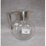 A VICTORIAN CHRISTOPHER DRESSER STYLE SILVER MOUNTED GLASS CLARET JUG, with angular handle and