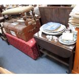 AN OAK STOOL, an Ottoman, a trolley and a cabin trunk