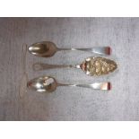 A GEORGE III SCOTTISH SILVER BERRY SPOON, two other George III silver table spoons and a Victorian