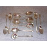 A SET OF TEN RAT-TAIL SILVER TABLESPOONS and a similar sauce ladle (11)