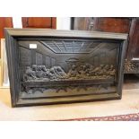 A LARGE CAST-IRON PLAQUE depicting 'The Last Supper' in relief, 18" high x 30" wide