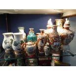 A PAIR OF ORIENTAL VASES with hand painted decoration, 7" high and a collection of similar