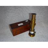 A SMALL STUDENT'S POCKET MICROSCOPE in mahogany box