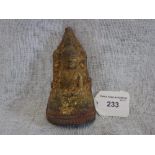 A BURMESE POTTERY VOTIVE PLAQUE/BUDDAH with remnants of gilding, 4.5" high