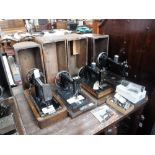 A VICTORIAN WHEELER & WILSON SEWING MACHINE and three others similar, all with cases (4)