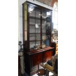 A LARGE GEORGE III STYLE MAHOGANY LIBRARY BOOKCASE, the upper glazed section with adjustable shelves