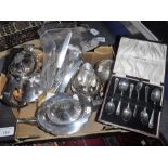 A SILVER PLATED FOUR PIECE TEASET, a set of silver plated teaspoons in fitted case and other