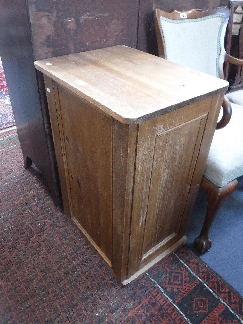 A PINE CUPBOARD with a hinged top, 30" high x 21" wide