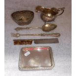 A CONTINENTAL SILVER PIERCED BASKET, a white metal serving spoon with a leaf formed bowl and other