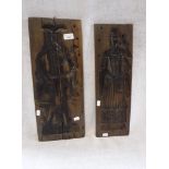 A PAIR OF GERMAN CARVED WOOD GINGERBREAD MOULDS in the form of a man and woman in period costume,
