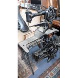 A VINTAGE SINGER SEWING MACHINE, for glove making/leather work, with hand action and treadle base