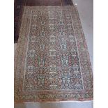 A TRADITIONAL BLUE GROUND PERSIAN RUG with all over floral decoration, 49" x 79"