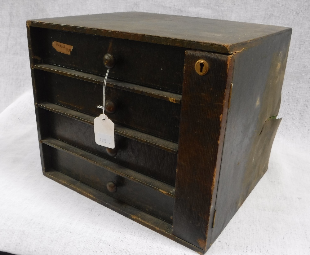 AN EDWARDIAN GREEN LEATHER COVERED FOUR DRAWER TABLE CABINET and two brushes in a similar case