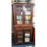 A 19TH CENTURY MAHOGANY BOOKCASE with glazed upper and lower sections and central drawer, 78" high x