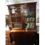 A 19TH CENTURY MAHOGANY LIBRARY BOOKCASE, the glazed upper section fitted adjustable shelves the