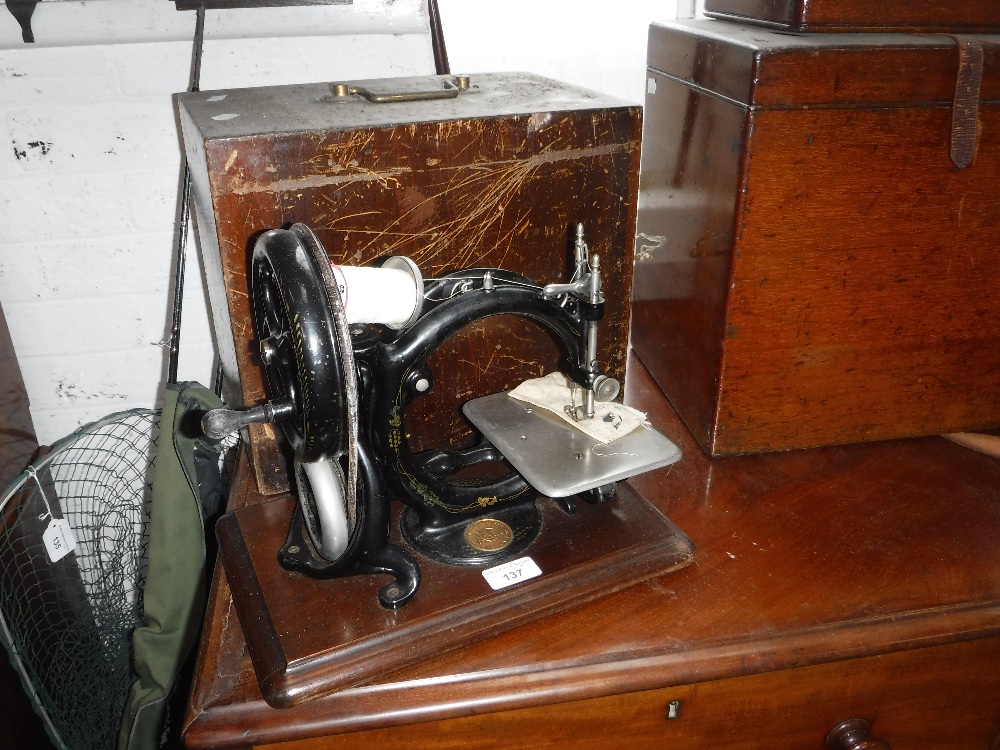 A VICTORIAN WILLCOX & GIBBS SEWING MACHINE with original case