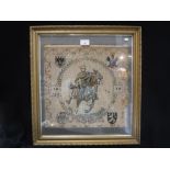 A FIRST WORLD WAR NEEDLEWORK depicting an Cavalry Officer on horseback, surrounded by four crests,
