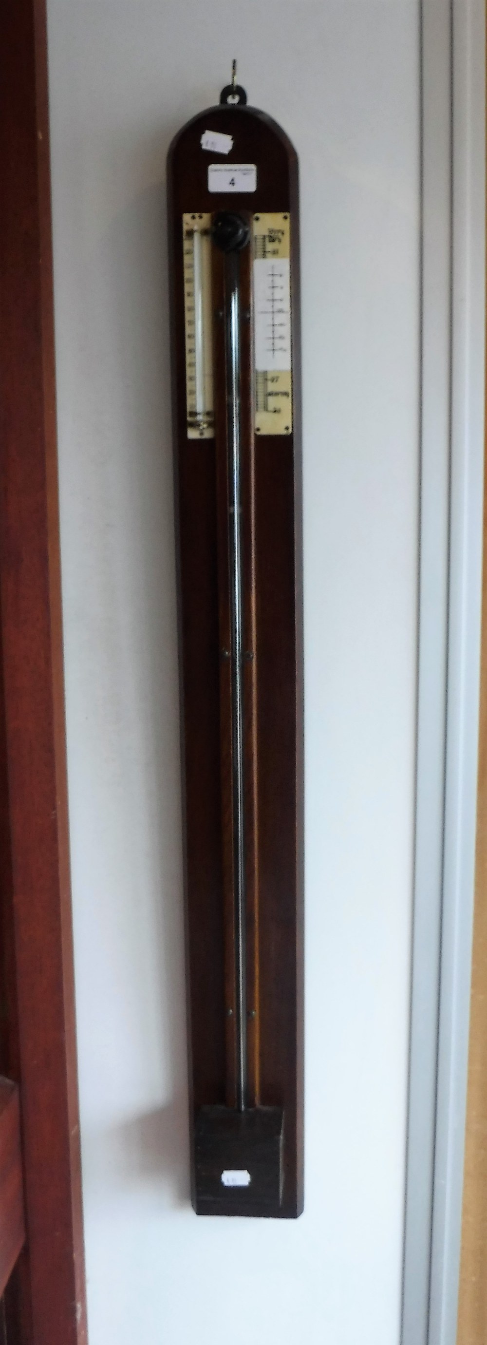 A STICK BAROMETER on an oak board, 39" high