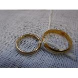 A 22CT YELLOW GOLD WEDDING BAND and another 9ct yellow gold wedding band (2)