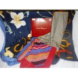 SALVATORE FERRAGAMO: A BLUE SILK SCARF depicting yellow flowers, the scarf in original packaging,