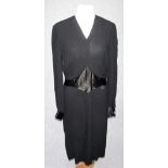 A 1930'S/40'S BLACK CREPE DE CHINE DRESS with shaped satin panel to the waist and satin cuffs