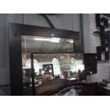 A LARGE WALL MIRROR in a black ash frame, 79'' high x 33'' wide and another similar