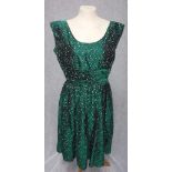 BRILKIE MODELS: A 1950'S GREEN SILK PARTY DRESS with all over irregular white spotted design