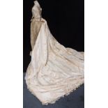 A VICTORIAN WEDDING DRESS comprising separate boned bodice, sleeves, underskirt (with lace