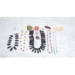 A COLLECTION OF COSTUME JEWELLERY including bead necklaces and brooches