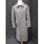 A GENTLEMAN'S DARK GREY WOOL SINGLE BREASTED LONG OVERCOAT with turn-back cuffs, chest size, circa