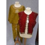 JASHAN BY ABU JANI & SANDEP KHOSLA; AN INDIAN EMBROIDERED SILK WAISTCOAT and a two-piece mustard